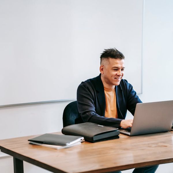 Person at a desk looking relaxed and focused.